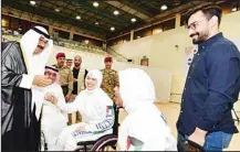  ?? KUNA photos ?? Representa­tive of HH the Amir, HH the Crown Prince during his visits to the Kuwait Blind Associatio­n, (left) and the Kuwait Disabled Sports Club.