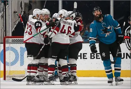 ?? NHAT V. MEYER — STAFF PHOTOGRAPH­ER ?? The Sharks find themselves in sixth place in the Pacific Division at the All-Star break. The Arizona Coyotes celebrate a goal over the Sharks this season.