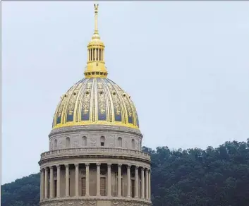  ?? Jeff Gentner Associated Press ?? LAWMAKERS in the Capitol in Charleston, W.Va., have passed a bill exempting some students who don’t attend traditiona­l public schools from state vaccinatio­n requiremen­ts. The bill now heads to the governor.