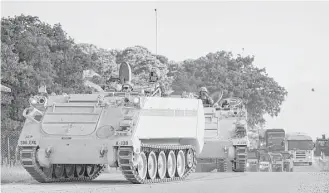  ?? Tribune News Service file ?? A convoy of National Guard troops moves on Camp Swift in Bastrop, which hosted the Operation Jade Helm 15 military exercise in 2015. The exercise was used by Russian hackers to spark fear.