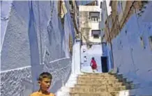  ??  ?? Children play on the steps in the Medina.