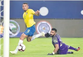  ??  ?? Brazil’s Gabriel Jesus scores past Saudi Arabia keeper Mohammed Al-Owais.