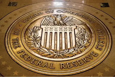  ?? (AP Photo/ Andrew Harnik,
File) ?? ABOVE In this Feb. 5, 2018, file photo, the seal of the Board of Governors of the United States Federal Reserve System is displayed in the ground at the Marriner S. Eccles Federal Reserve Board Building in Washington. As the Federal Reserve continues to increase interest rates, borrowers may find that they’re paying more for
their debts or perhaps missing out on opportunit­ies to boost their savings with better rates.