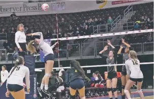  ??  ?? Santa Fe High sophomore Laila Bernardino prepares to spike the ball against the Hobbs defense during the opening round Thursday.