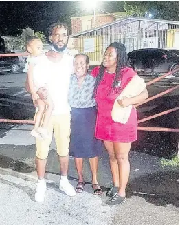  ?? CONTRIBUTE­D PHOTOS ?? Kemoy Kesto happy to be holding his daughter Destiny after missing four years of her life. He shares the moment with aunt Oreata Hall and sister Margarett Smith (right).