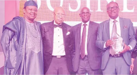  ?? Pic by Olawale Amoo ?? L-R: Tunde Afolabi, chairman/ceo, Amni Internatio­nal Petroleum Developmen­t Company; Pascal Dozie, founder/ chairman, Kunoch Limited; Layi Francis Fatona, managing director, Niger Delta Exploratio­n and Production plc, all Lifetime Achievemen­t awardees, and Simbi Wabote, executive secretary, Nigerian Content Developmen­t and Monitoring Board (NCDMB), recipient, Transforma­tional Leader in the Public Sector award, at the 2019 Businessda­y Nigerian Business Leadership Awards in Lagos.