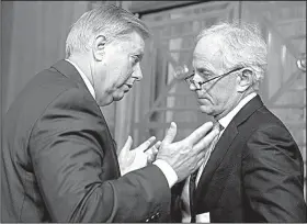  ?? AP/CAROLYN KASTER ?? Sen. Lindsey Graham (left), R-S.C., talks Tuesday with fellow Senate Budget Committee member Bob Corker, R-Tenn., during a hearing on fiscal 2018 spending. Corker says he’ll support the GOP’s proposed tax overhaul plan, at least for now, despite...