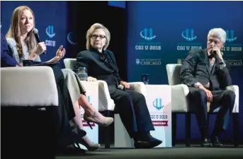  ??  ?? Chelsea Clinton speaks Saturday at the University of Chicago as Hillary Clinton and Bill Clinton look on.