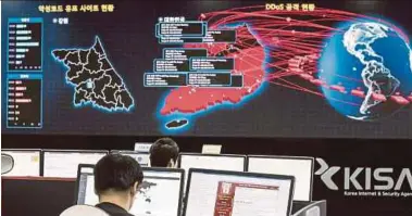  ?? AP PIC ?? Staff from Korea Internet and Security Agency (Kisa) in Seoul monitoring the spread of ransomware attacks yesterday.