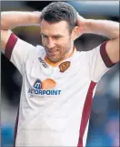  ??  ?? SINKING FEELING: Stephen McManus rues his mistake against Rangers