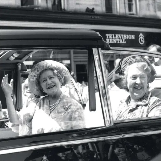  ??  ?? ‘Very hard work but great fun’: the Queen Mother and Dame Frances Campbell-preston, visiting Wells, Somerset