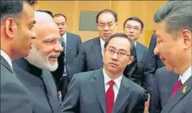  ?? PTI FILE PHOTO ?? Prime Minister Narendra Modi and Chinese President Xi Jinping exchange greetings at the BRICS leaders' informal gathering in Hamburg, Germany.