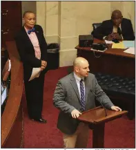  ?? Arkansas Democrat-Gazette/STATON BREIDENTHA­L ?? Sen. Joyce Elliott (left), D-Little Rock, listens to Sen. Trent Garner, R-El Dorado, as he speaks against a resolution for the Poor People’s Campaign on Monday in the Senate chamber. The resolution, sponsored by Elliott, failed to pass.