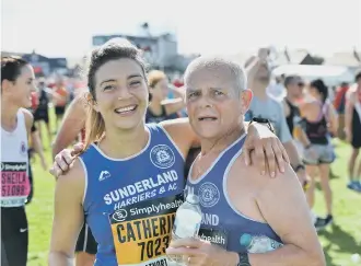  ??  ?? Catherine Purdy and Len Christophe­r after completing this year’s Great North Run.