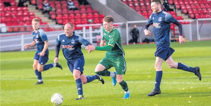  ??  ?? Left standing Robbie Mcgale bursts through the Vale of Leithen defence before scoring. All photos by George Vekic