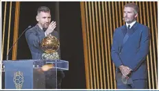  ?? ?? Alongside Inter Miami co-owner David Beckham, Lionel Messi gives a speech after winning his eighth Ballon d'Or at an awards ceremony in Paris on 30 October 2023.