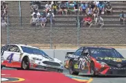 ?? / AP-Ben Margot ?? Martin Truex Jr. (78) leads Kevin Harvick (4) through a turn during Sunday’s Monster Energy NASCAR Cup Series race at Sonoma Raceway in Sonoma, Calif. Truex won the Save Mart 350, followed by Kevin Harvick, Clint Bowyer, Chase Elliott and Kyle Busch.