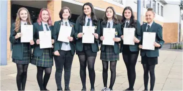  ??  ?? Success Lauren Walker, Abigail Duffy, Abri Anna Nicol-wood, Mia Houston, Abigail Harkness, Hannah Tierney and Elina Fox were National 5 7 A pupils