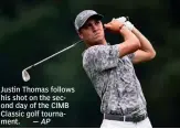  ?? — AP ?? Justin Thomas follows his shot on the second day of the CIMB Classic golf tournament.