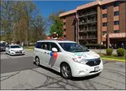  ??  ?? A drive-by/social distance celebratio­n took place May 13 at Sacred Heart Chapel for Father Bill Thaden.