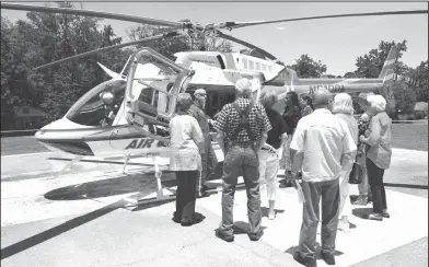  ?? Submitted Photo ?? Helicopter tour: Members of the El Dorado Senior Circle tour one of Pafford Air One's helicopter­s on Wednesday, June 7. At the meeting, members of the Senior Circle were educated on why helicopter­s are the fastest emergency transporti­ng service...