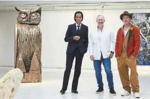  ?? — afp ?? british artist thomas Houseago (centre) posing with us actor brad pitt (right) and australian musician Nick Cave at the opening of the exhibition at the Sara Hilden art museum in tampere, Finland.