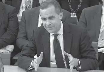  ?? U.K. PARLIAMENT /REUTERS ?? Mark Carney answers questions last February from British parliament­arians over his unexpected appointmen­t as the next governor of the Bank of England. He was grilled over his $1.3-million-a-year compensati­on package.