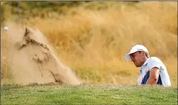  ?? AP/PETER MORRISON ?? Jordan Spieth hits out of a bunker on the 14th hole during a practice round at Carnoustie earlier this week. Spieth will attempt to become the fifth player in the past 50 years to win consecutiv­e British Opens.