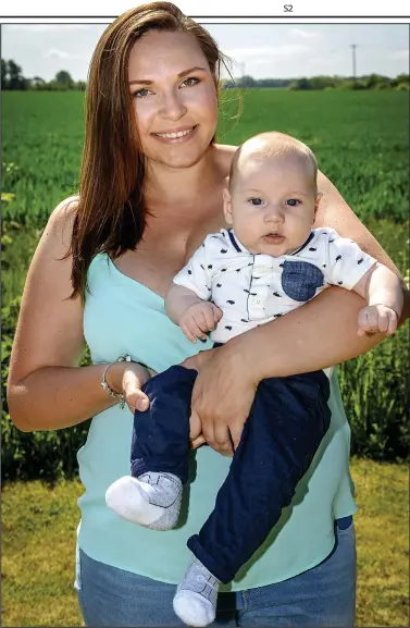  ??  ?? Big impression: Diana Kuznetsova, 29, with son Jack, who weighed 17lbs at ten weeks