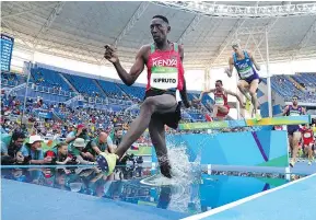  ?? — GETTY IMAGES ?? Conseslus Kipruto of Kenya captured gold in the men’s 3,000-metre steeplecha­se Wednesday at Olympic Stadium.