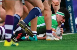  ??  ?? Henry Godson celebrates after scoring Gonzaga’s first try against Clongowes