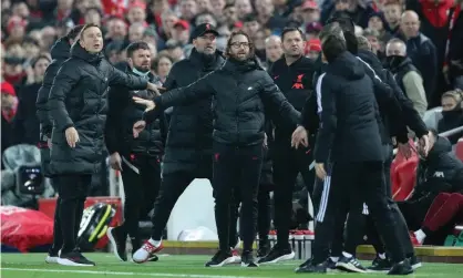  ?? Tomiyasu. Photograph: Paul Greenwood/Shuttersto­ck ?? Jürgen Klopp clashes with Mikel Arteta last Saturday after the Arsenal bench appealed for a card when Sadio Mané caught Takehiro