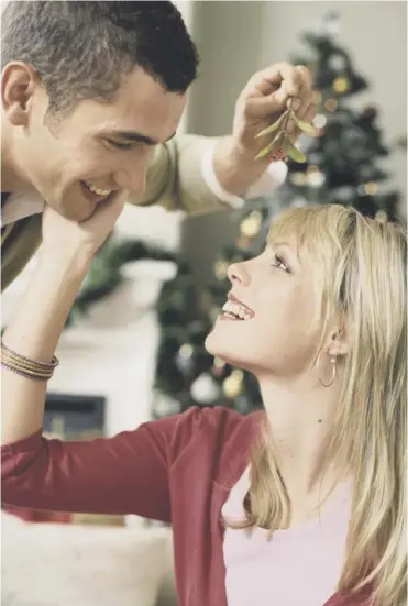  ??  ?? 0 Kissing under the mistletoe is a Christmas tradition with origins perhaps in Norse mythology