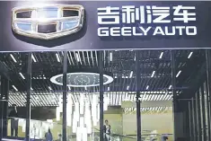  ??  ?? The Geely Automobile Holdings logo is pictured at the Auto China 2016 auto show in Beijing, China. — Reuters photo