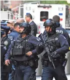  ?? USA TODAY ?? Police work the scene at Columbus Circle in New York, where a suspicious package was found at CNN.