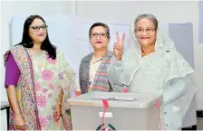  ??  ?? Sheikh Hasina gestures after casting her vote in the December 30th general elections. Reuters