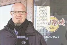  ?? MARK THIESSEN/AP ?? General manager Scott Brokaw stands outside the new Hard Rock Cafe under constructi­on in Anchorage, Alaska. The restaurant will open in late spring 2014, and is another national chain that is opening locations in Alaska’s largest city.