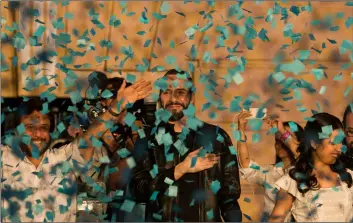  ??  ?? Presidenti­al candidate Nayib Bukele, of the Grand Alliance for National Unity, center, his wife Gabriela, right, and the Vice-president candidate Felix Ulloa wave supporters in San Salvador, El Salvador, on Sunday. AP PhoTo/MoIses CAsTIllo