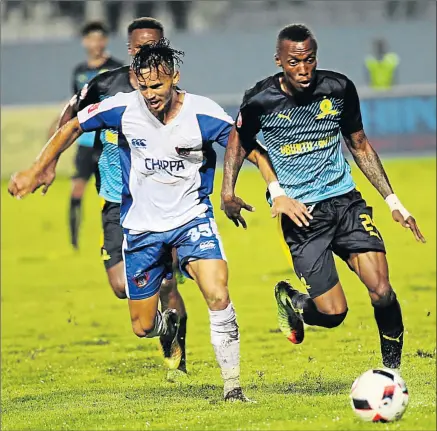  ?? Picture: SINO MAJANGAZA ?? EYES ON THE BALL: Kristopher Bergman of Chippa United, left, chases Yannick Zakri of Mamelodi Sundowns during last night’s Premier Soccer League match at Sisa Dukashe, in Mdantsane, East London