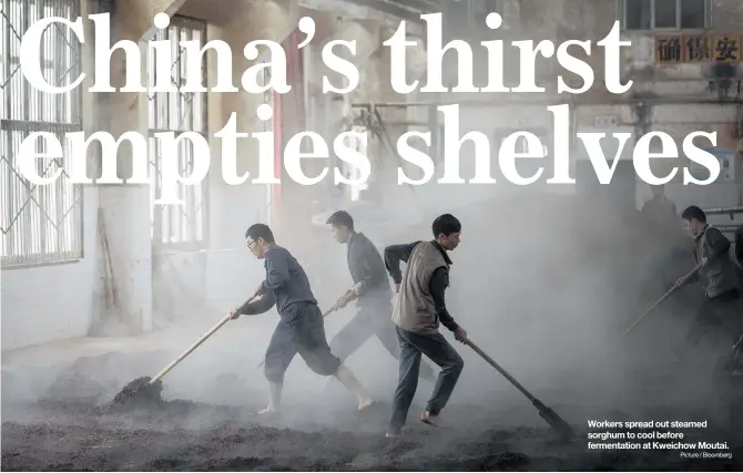  ?? Picture / Bloomberg ?? Workers spread out steamed sorghum to cool before fermentati­on at Kweichow Moutai.