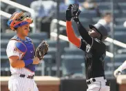  ?? Sarah Stier / Getty Images ?? Marlins rookie Jazz Chisholm Jr. crosses home plate after homering off the Mets’ Jacob deGrom.