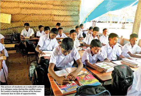  ??  ?? File picture of students at a makeshift school in a refugee camp during the conflict years. Sri Lanka is losing the cream of its human resource due to lack of opportunit­ies.