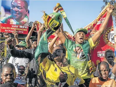  ?? Picture: GETTY IMAGES/DAN KITWOOD ?? MUCH TO CHEER: People in Mbare celebrate after Zimbabwe Electoral Commission officials announced the re-election of President Emmerson Mnangagwa.