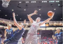  ?? ROBERTO E. ROSALES/JOURNAL ?? UNM senior Richelle van der Keijl (15) stretches for a rebound against Nevada. The 6-foot-5 transfer admits she gets frustrated when she is double-teamed, but knows she needs to produce.