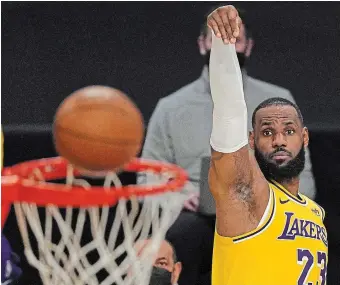  ?? MARK J. TERRILL THE ASSOCIATED PRESS FILE PHOTO ?? Lakers forward LeBron James shoots against the Oklahoma City Thunder in February 2021 in Los Angeles. James is just 63 points away from passing Kareem Abdul-Jabbar’s all-time total of 38,387.