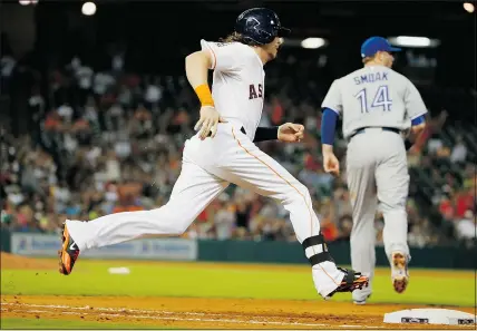  ?? GETTY IMAGES ?? Former Blue Jay Colby Rasmus, now with Houston, reaches base on a ground-rule double in the sixth inning against Toronto at Minute Maid Park on Saturday in Houston.