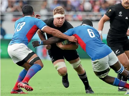  ?? GETTY IMAGESthe ?? Sam Cane tries to break through the tackles of Justin Newman and Prince Gaoseb during the World Cup pool match against Namibia in Japan last year.