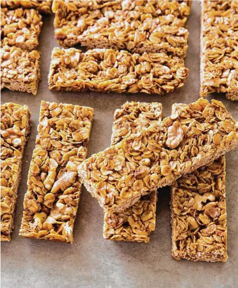  ?? Joe Keller / America’s Test Kitchen ?? These granola bars from “The Perfect Cookie” rely on simple flavors — a little brown sugar for extra sweetness, aromatic vanilla and cinnamon, and chopped nuts for crunch.