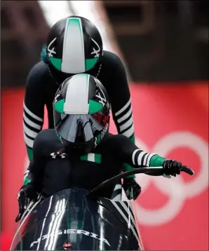  ??  ?? Driver Seun Adigun and Akuoma Omeoga of Nigeria start their first heat during the women’s two-man bobsled competitio­n at the 2018 Winter Olympics in Pyeongchan­g, South Korea, Tuesday, Feb. 20, 2018. AP Photo/AnDy WonG