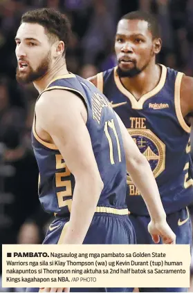  ?? /AP PHOTO ?? ■ PAMBATO. Nagsaulog ang mga pambato sa Golden State Warriors nga sila si Klay Thompson (wa) ug Kevin Durant (tup) human nakapuntos si Thompson ning aktuha sa 2nd half batok sa Sacramento Kings kagahapon sa NBA.